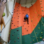 Woman climbing indoor climbing wall